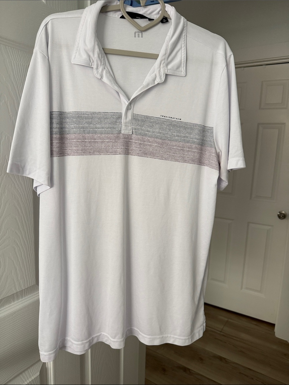 Travis Mathew Men's White Polo with Subtle Stripe Detail